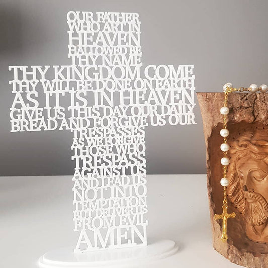 Freestanding lasercut acrylic prayer cross with the Lord’s Prayer, available in multiple colours, shown on a matching base for tabletop display.