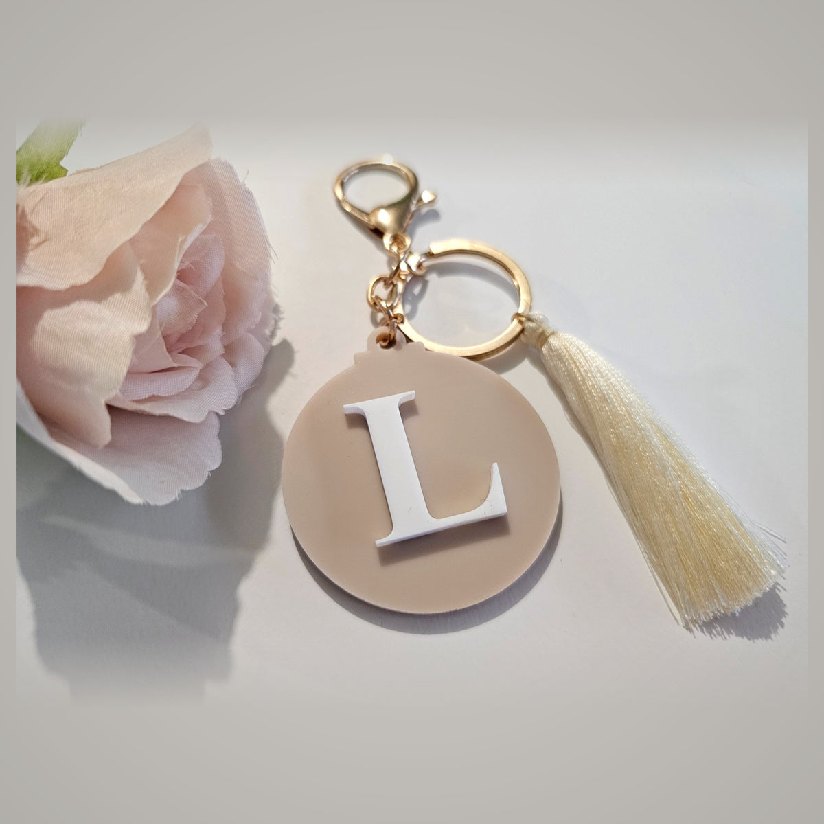 Personalised acrylic initial L keyring with cream tassel and gold clasp - letter bag charm gift