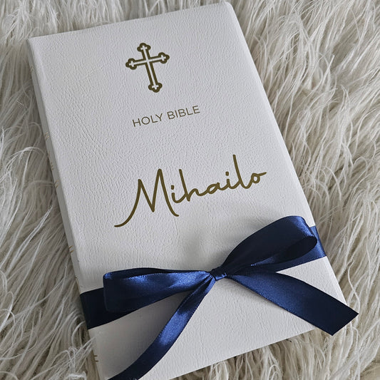 Personalised Orthodox Bible with a custom gold foil name, Orthodox cross, and navy blue ribbon – a perfect baptism or christening gift.