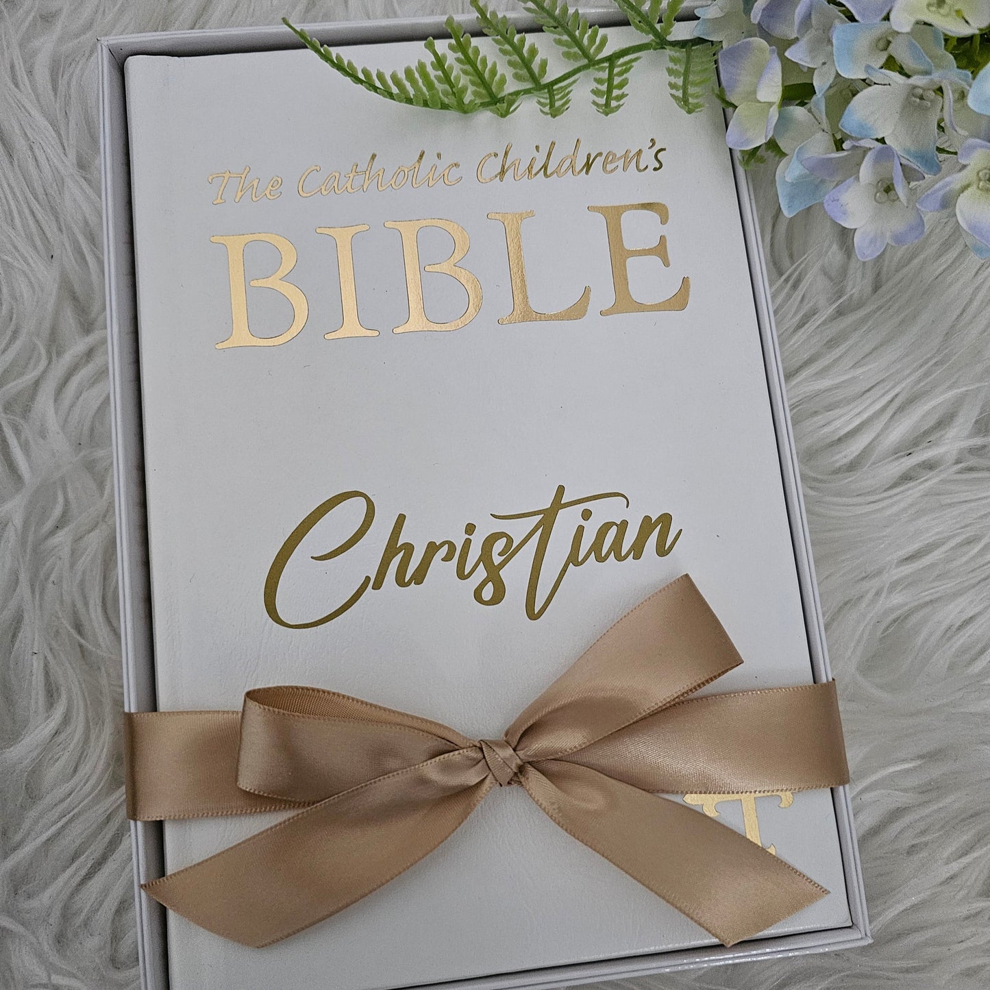 Personalised Catholic Children's Bible with a custom name cover, gold detailing, and a soft ribbon – perfect for baptisms, first communions, and christenings.