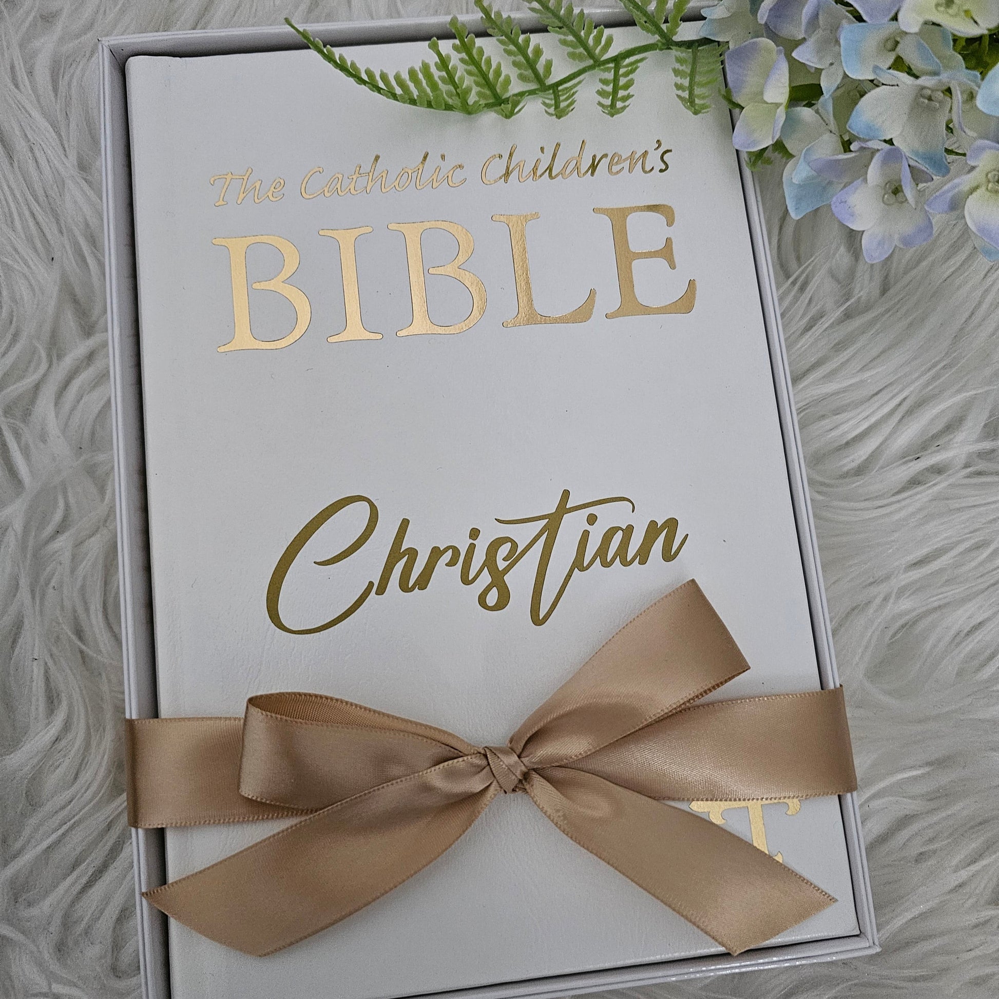 Personalised Catholic Children's Bible with a custom name cover, gold detailing, and a soft ribbon – perfect for baptisms, first communions, and christenings.