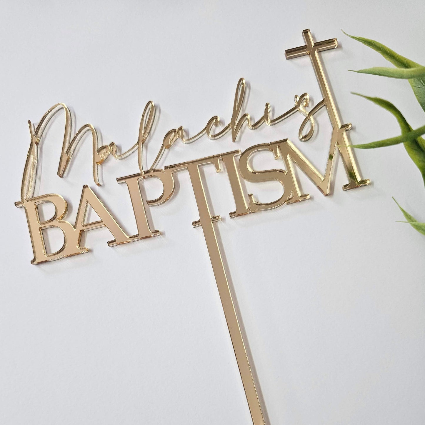 Elegant baptism cake topper featuring a custom name in script and block letters, accented with a cross. Perfect for christenings and religious celebrations.