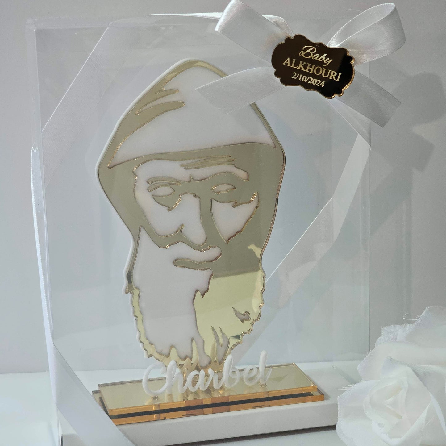 Acrylic bomboniere featuring a stylised St Charbel silhouette on a freestanding base with personalised with box ribbon and tag