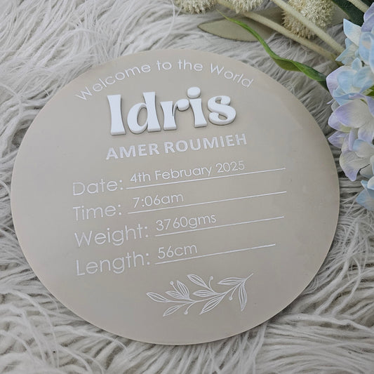 Acrylic birth announcement plaque with raised 3D script first name and UV printed full name and birth details in serif and script fonts.