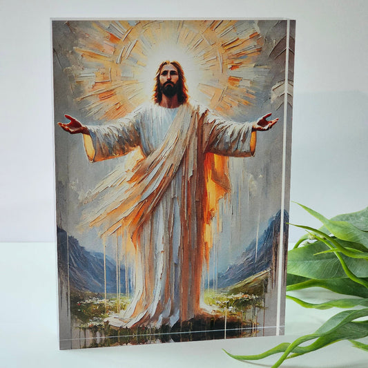 UV printed 20mm clear acrylic block featuring radiant robed figure with outstretched arms and mountain backdrop, boxed for gifting.