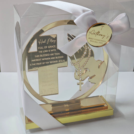Acrylic Hail Mary prayer cross with rosary motif, displayed in a gift box with ribbon and personalised name tag.