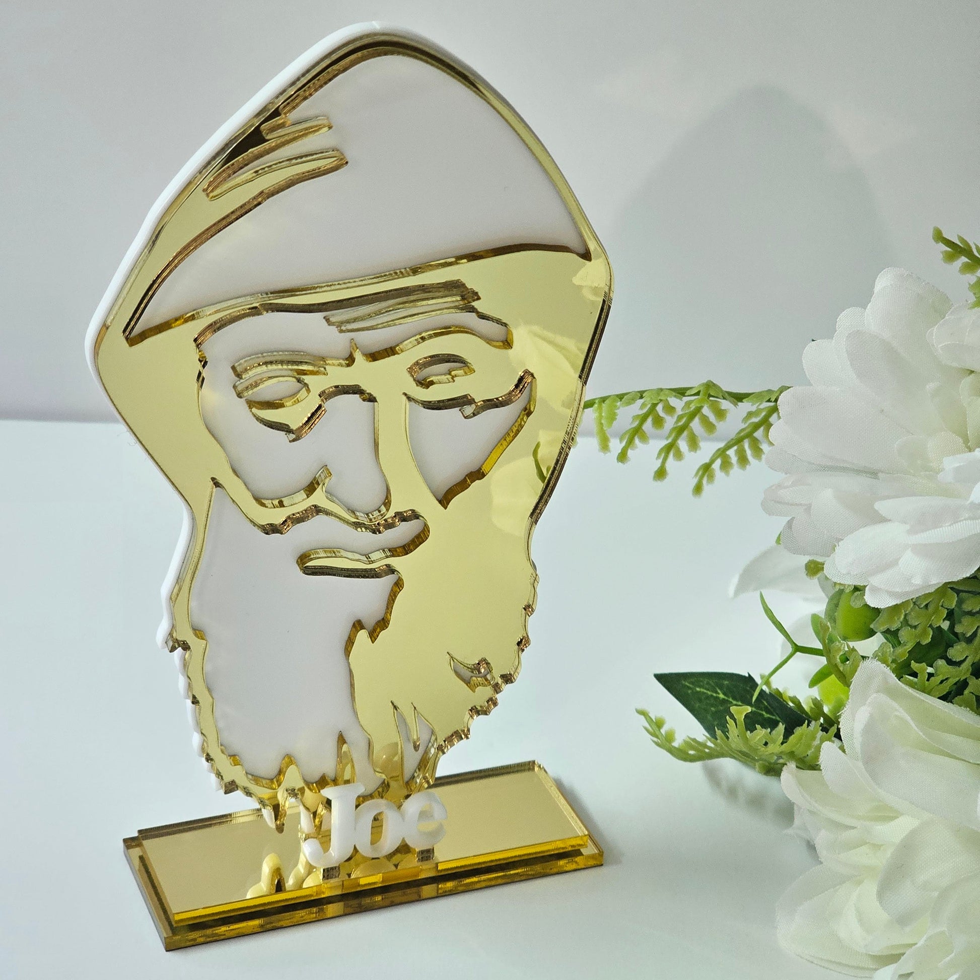 Acrylic bomboniere featuring a stylised St Charbel silhouette on a freestanding base with personalised name.