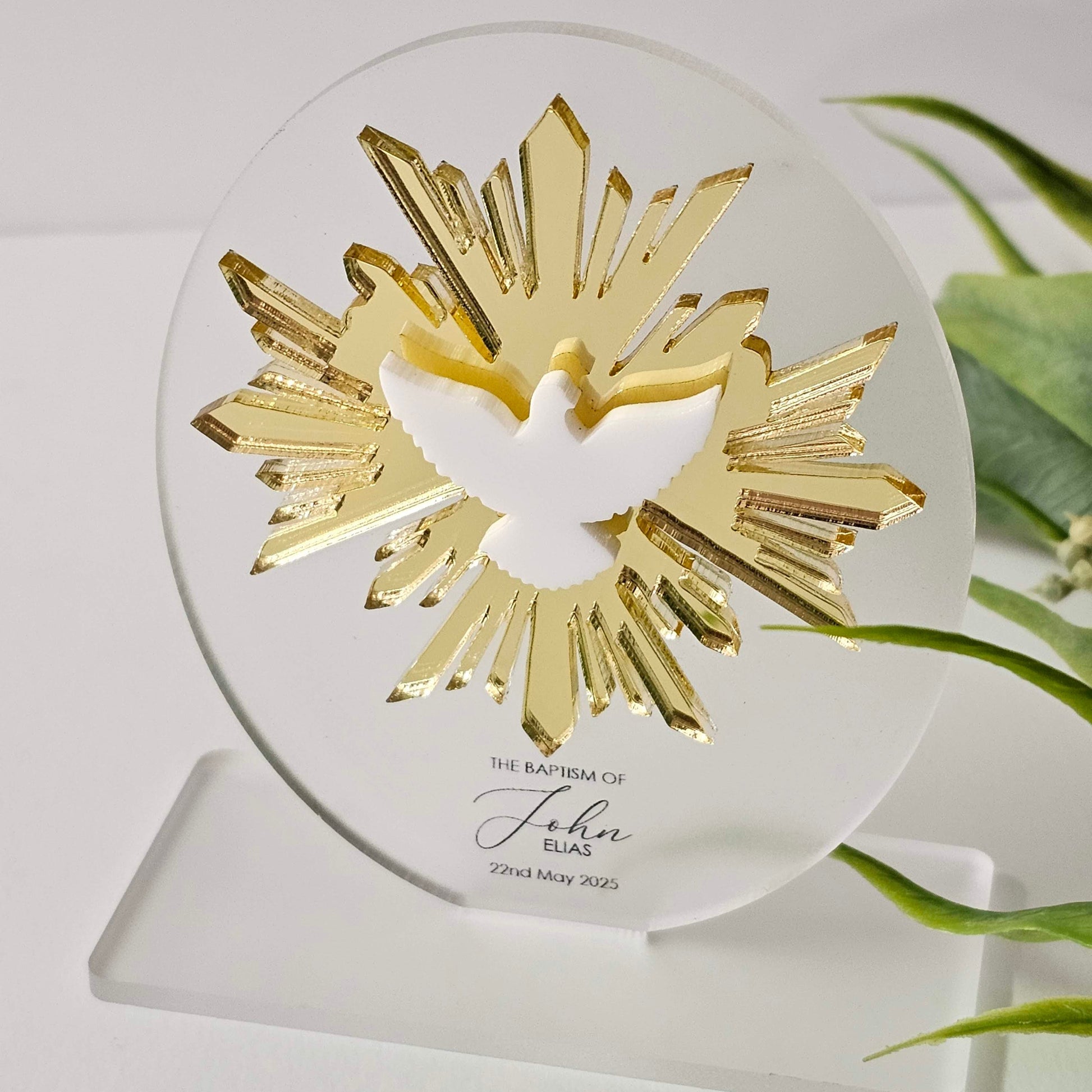 Clear acrylic religious plaque with gold radiant dove design, custom UV printed  name, mounted on a rectangular base.
