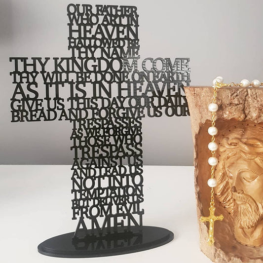 Freestanding lasercut acrylic prayer cross with the Lord’s Prayer, available in multiple colours, shown on a matching base for tabletop display.