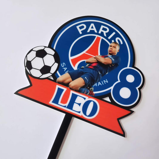 Kylian Mbappé PSG-themed acrylic cake topper featuring the Paris Saint-Germain logo, a soccer ball, a bold number 8, and a red banner with the name "LEO".