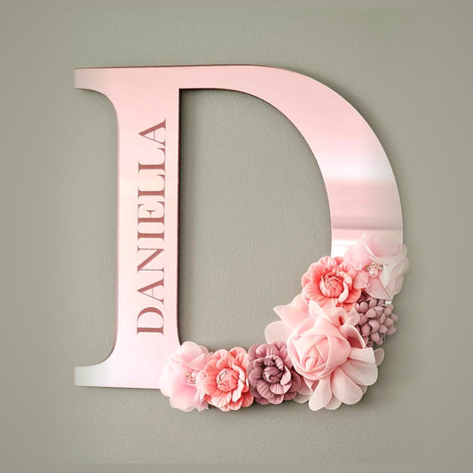 Pink mirror acrylic initial letter D engraved with name and decorated with flowers - personalised nursery wall decor