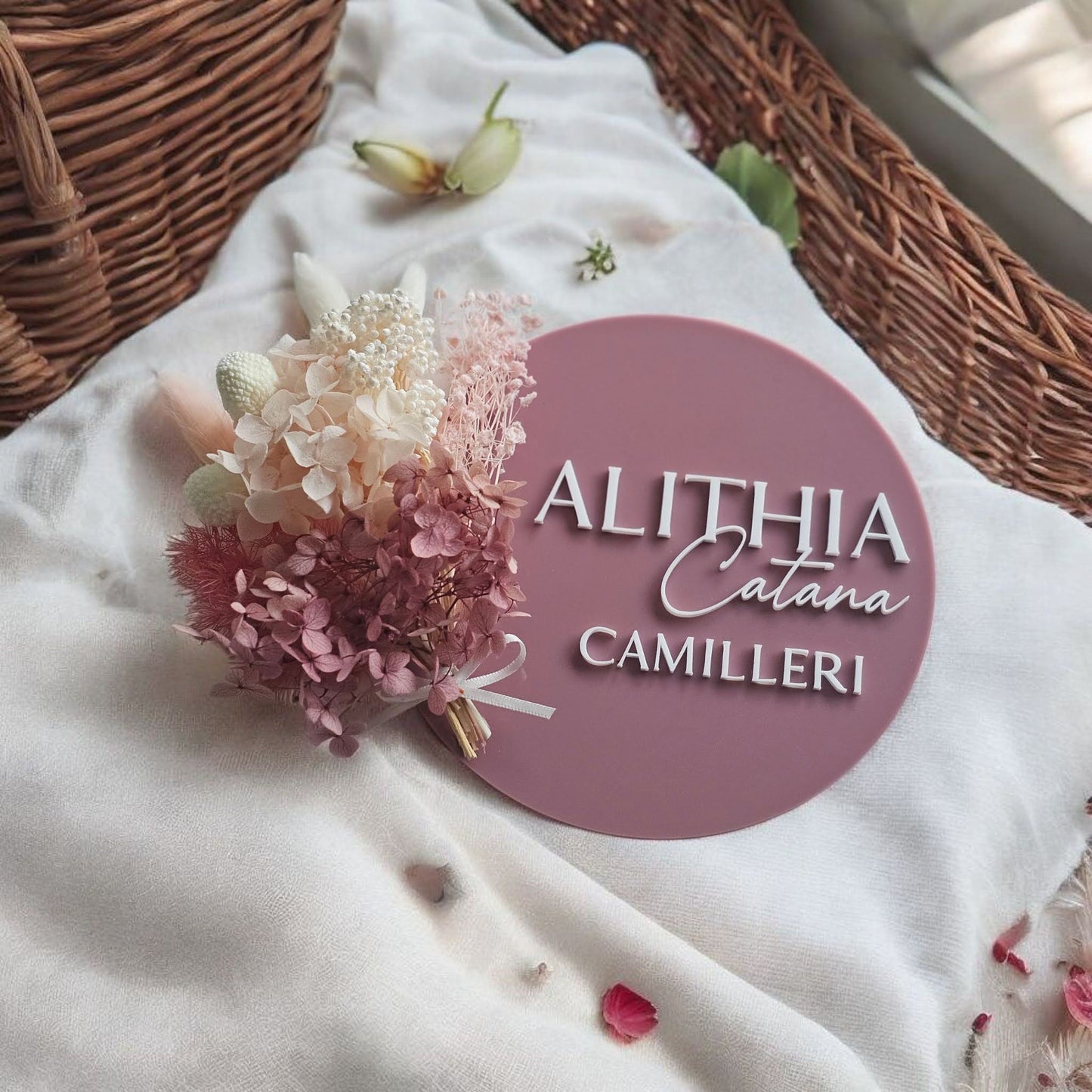 Personalised mauve acrylic baby name plaque with 3D lettering “Alithia Calana Camilleri,” styled with pink florals