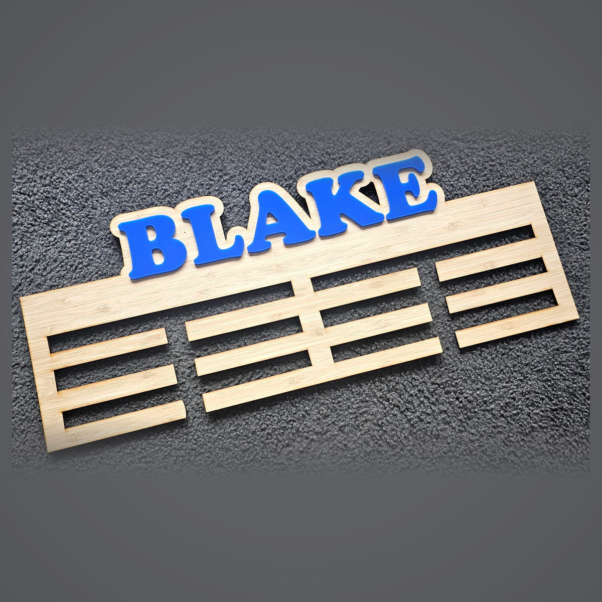 Custom medal hanger with blue name for kids sport - personalised medal display rack