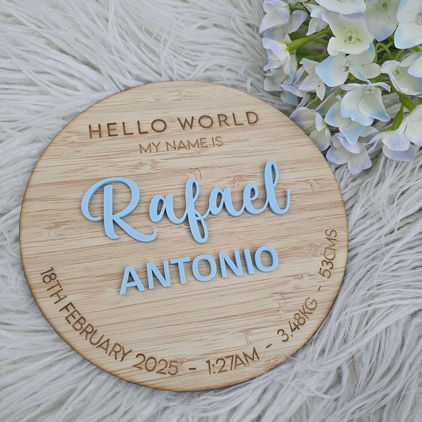 Wooden Hello World baby name plaque with engraved birth details and raised blue acrylic text — personalised newborn announcement keepsake