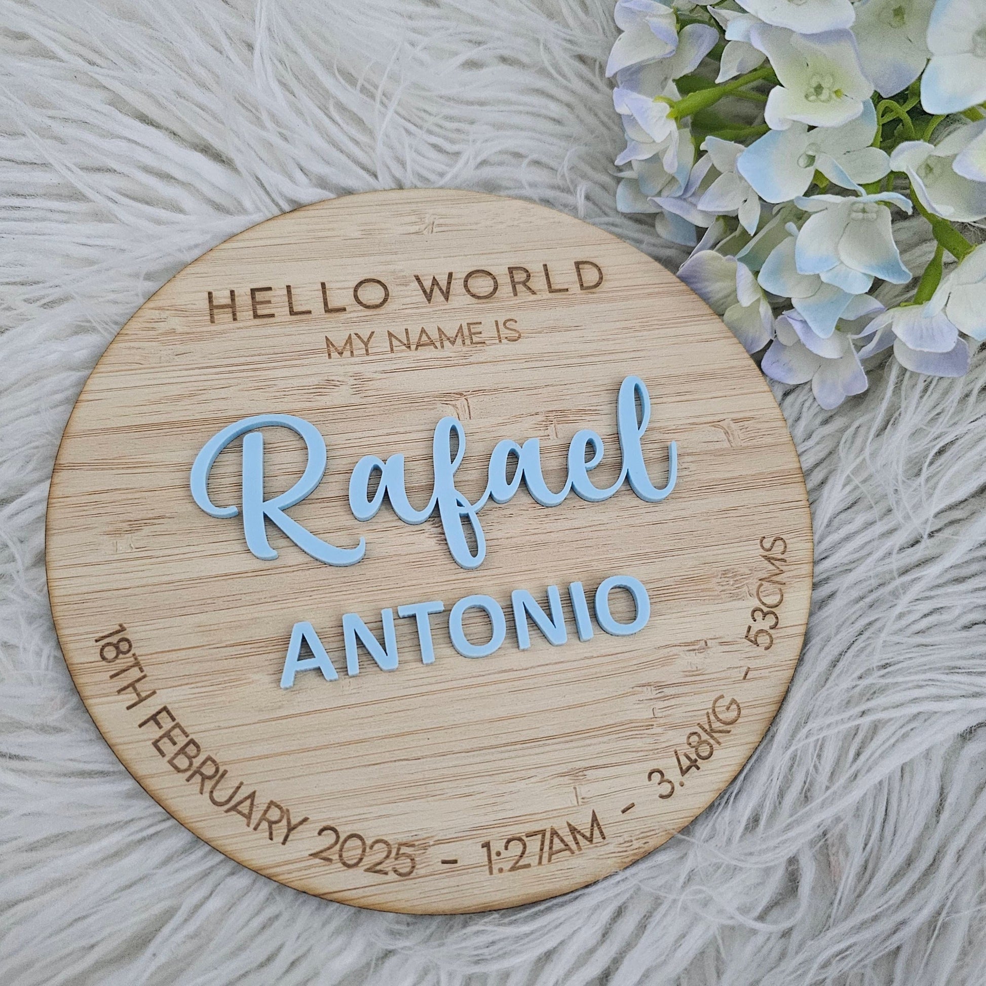 Wooden Hello World baby name plaque with engraved birth details and raised blue acrylic text — personalised newborn announcement keepsake